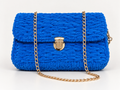 Royal blue chenille shoulder bag with gold chain strap and gold-tone clasp