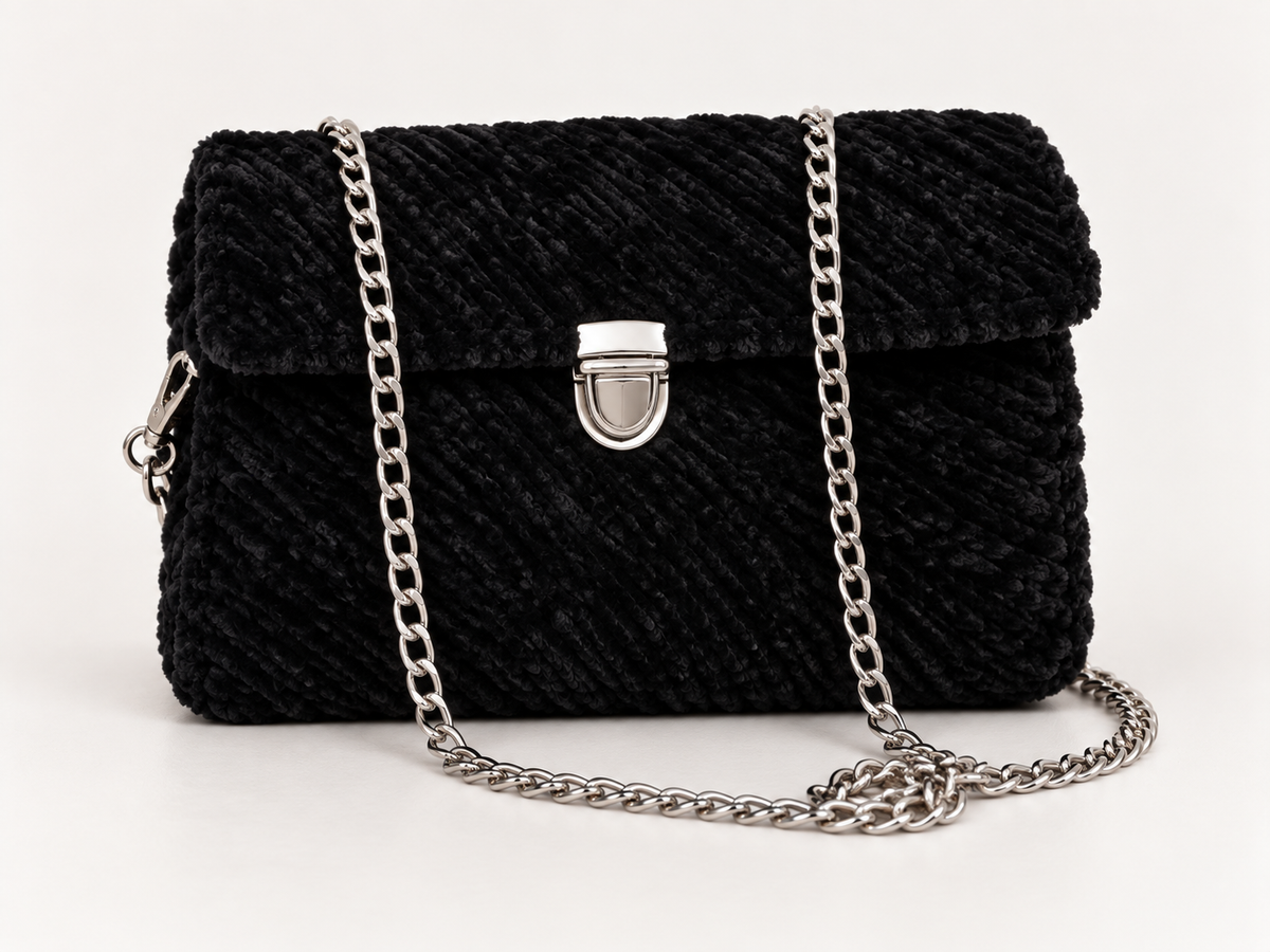 Black chenille shoulder bag with silver chain strap and silver-tone clasp