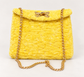 Sunny yellow chenille shoulder bag with gold chain strap and decorative gold clasp
