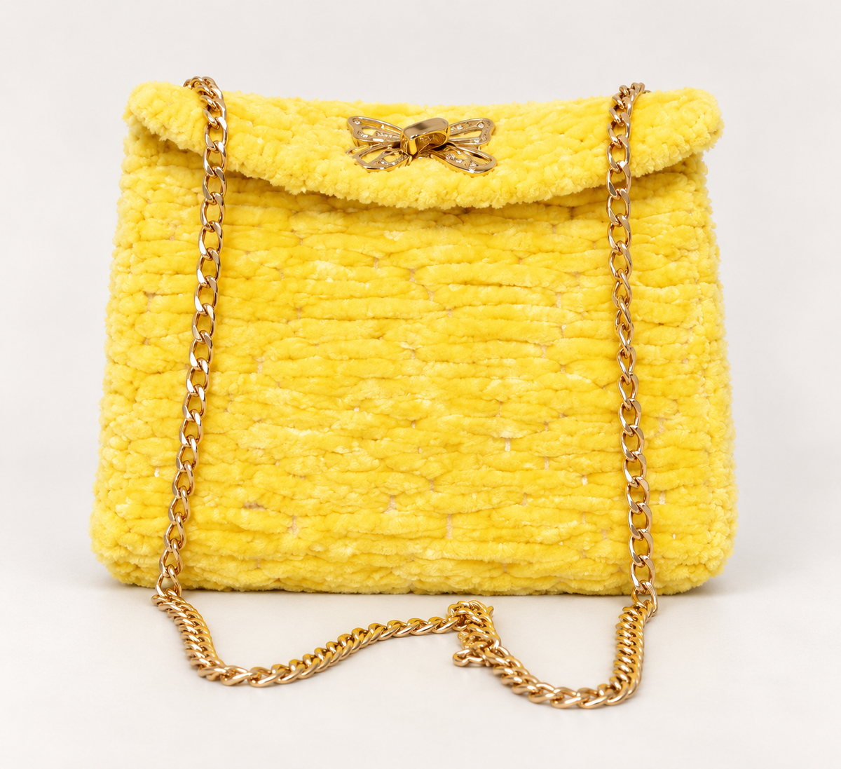 Sunny yellow chenille shoulder bag with gold chain strap and decorative gold clasp