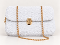White chenille shoulder bag with gold chain strap and gold-tone clasp