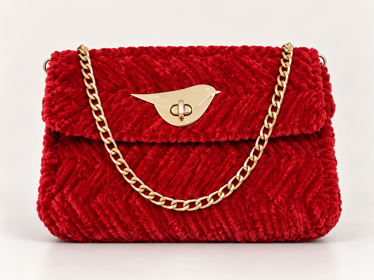 Red chenille shoulder bag with gold chain strap and gold-tone front clasp